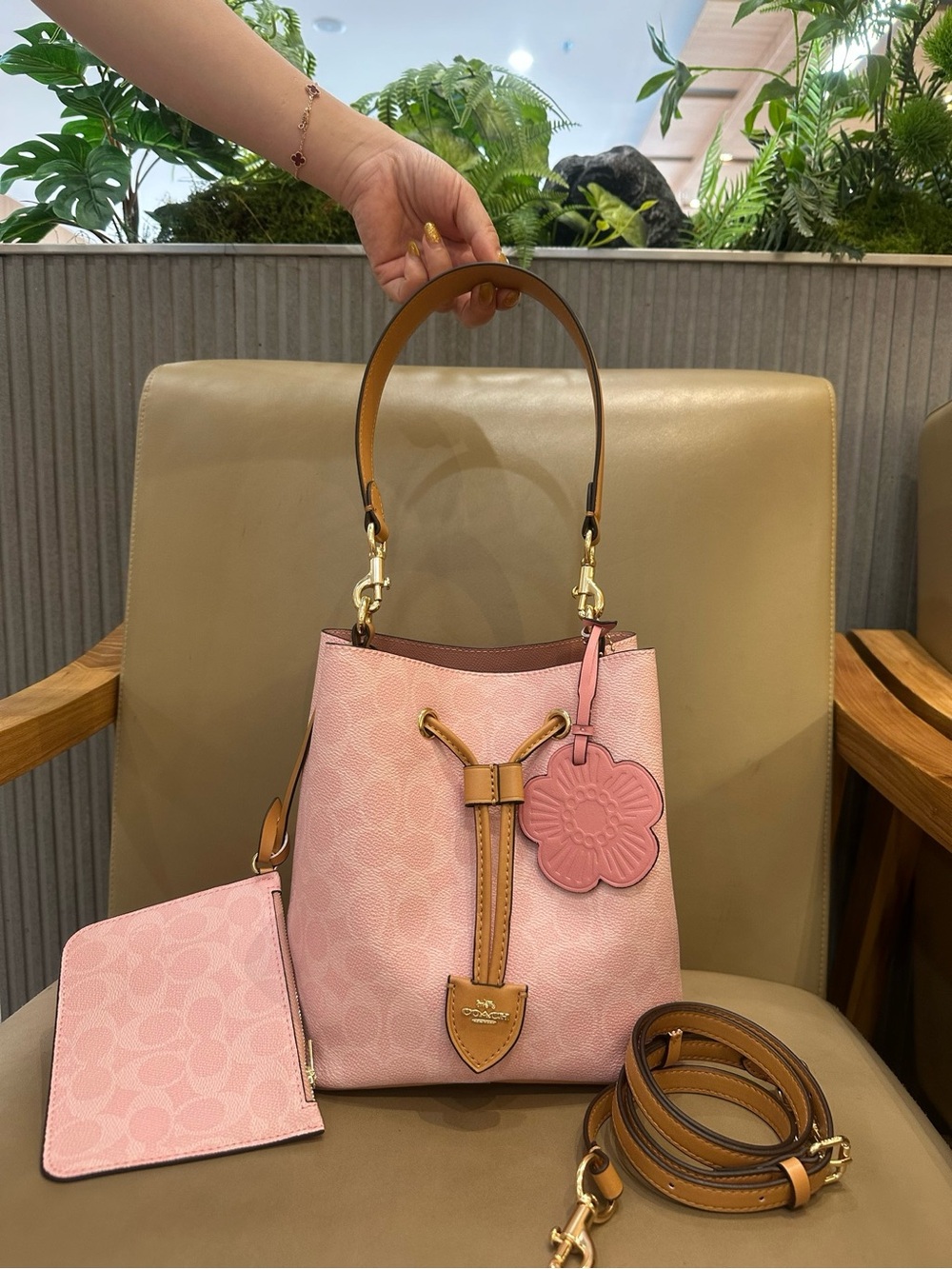 Coach Pink Pebble Leather Drawstring Bucket Bag with Tan Trim and Floral Charm - Picture 4 of 9